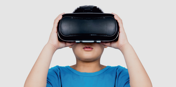 child wearing VR headset in blue shirt